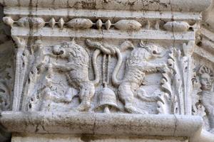 VENICE, ITALY - SEPTEMBER 15 2019 - doge ducal palace capital of column wayside sculpture detail photo