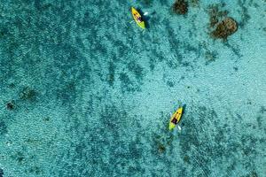 Canoe and kayaks in Polynesia Cook Island tropical paradise aerial view photo