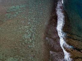 aerial view of waves on reef of polynesia Cook islands photo