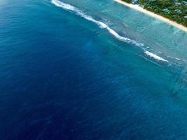 aerial view of waves on reef of polynesia Cook islands photo
