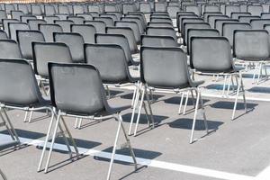 Many empty chairs without audience photo