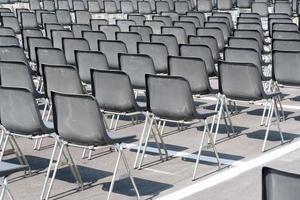 Many empty chairs without audience photo