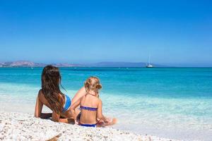 Young mother and her adorable little daughter during summer vacation photo