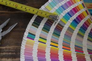 Color swatches used in graphic arts, with a measuring tape used in construction photo