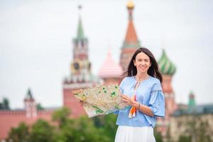 Happy young urban woman in european city. photo