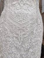 bride white dress lace detail photo