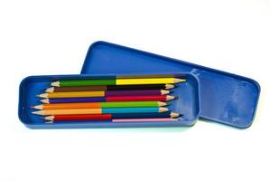 Colorful crayon, color pencil in blue box photo