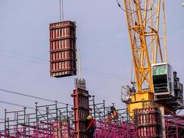 The pink scaffolding on the building under construction photo