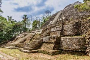 Central ancient pyramid of old Mayan civilization city,  Lamanai archeological site, Orange Walk District, Belize photo