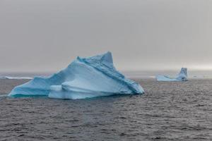 Iceberg drifting at Lemaire Channel, Antarctica photo