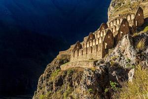 Pinkuylluna, ruins of ancient Inca storehouses located on mountains, Sacred Valley, Ollantaytambo, Peru photo