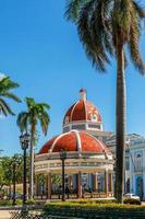 Cienfuegos Jose Marti central park with palms and historical bui photo