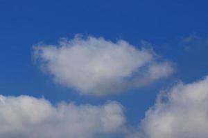 Clear blue sky and white clouds photo