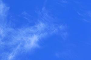 Clear blue sky and white clouds photo