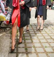 university graduating students are having a photo shooting in the park