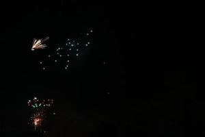 Colorful fireworks on the black sky background photo