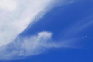 Clear blue sky and white clouds photo