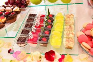 Delicious sweets arranged on the table for events reception photo