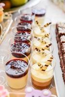 delicious sweets arranged on the table for event reception photo