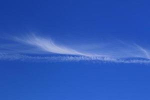 Clear blue sky and white clouds photo