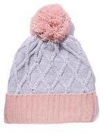 Gray-pink knitted hat with a pom-pom on a white isolated background photo