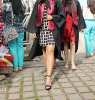 university graduating students are having a photo shooting in the park