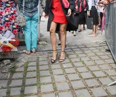 university graduating students are having a photo shooting in the park