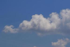 Clear blue sky and white clouds photo