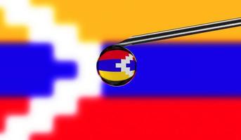 Vaccine syringe with drop on needle against national flag of Nagorno Karabakh Republic background. Medical concept vaccination. Coronavirus Sars-Cov-2 pandemic protection. National safety idea. photo