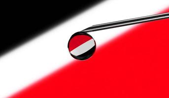 Vaccine syringe with drop on needle against national flag of Sealand Principality of background. Medical concept vaccination. Coronavirus Sars-Cov-2 pandemic protection. National safety idea. photo