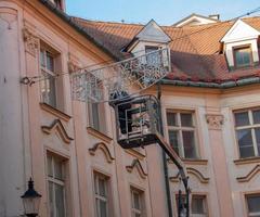 Bratislava, Slovakia - 01.07.2023 Municipal services of Bratislava remove Christmas illumination in old Bratislava photo