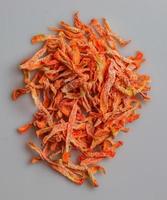 Organic Dehydrated Carrots. Freeze Dried Carrot Pieces. Air Dried Vegetables Dehydrated Carrot Slice Flakes Granules. Carrot background. photo