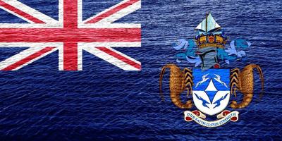 Flag of the British Overseas Territory of the Tristan da Cunha Island on a textured background. Concept collage. photo