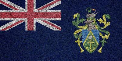 Flag of the British Overseas Territory of Pitcairn Islands on a textured background. Concept collage. photo