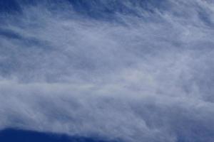 Clear blue sky and white clouds photo