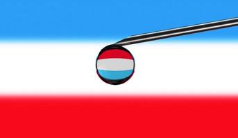 Vaccine syringe with drop on needle against national flag of Luxembourg background. Medical concept vaccination. Coronavirus Sars-Cov-2 pandemic protection. National safety idea. photo