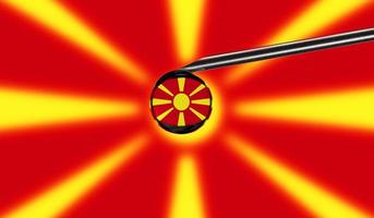 Vaccine syringe with drop on needle against national flag of Macedonia background. Medical concept vaccination. Coronavirus Sars-Cov-2 pandemic protection. National safety idea. photo