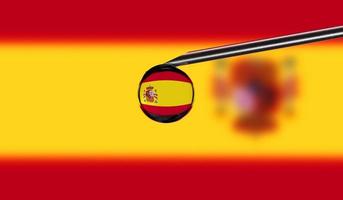 Vaccine syringe with drop on needle against national flag of Spain background. Medical concept vaccination. Coronavirus Sars-Cov-2 pandemic protection. National safety idea. photo