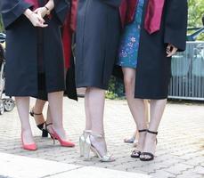 university graduating students are having a photo shooting in the park