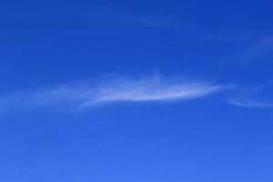 Clear blue sky and white clouds photo