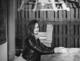 brunette woman in leather jacket photo