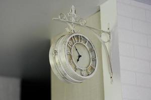 old vintage clock in the interior photo