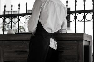 waiter wearing black apron photo