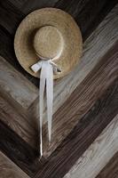 straw hat hang on wall photo