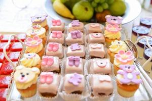 delicious sweets arranged on the table for event reception photo