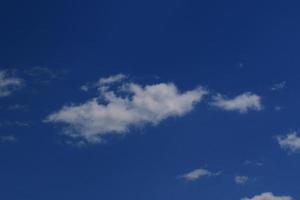 Clear blue sky and white clouds photo