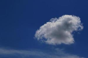 Clear blue sky and white clouds photo