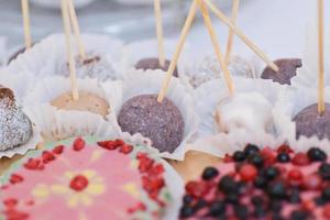 tasty vegan sweets arranged on the table for wedding reception photo