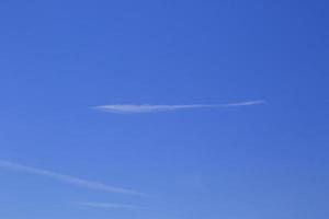 Clear blue sky and white clouds photo