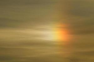 Rays of light shining through dark clouds photo